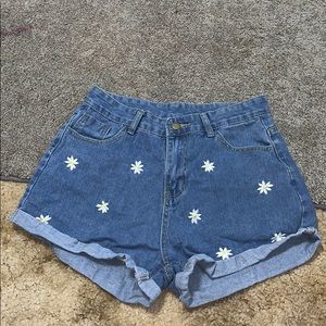 Jean shorts, with daisys on them